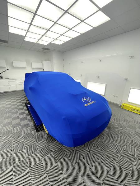 PREPARATION ESTHETIQUE, POSE D'UNE CIRE et fourniture d'une HOUSSE D'INTERIEUR sur une SUBARU IMPREZA WRX STI de 2003 à CULOZ dans l'AIN..